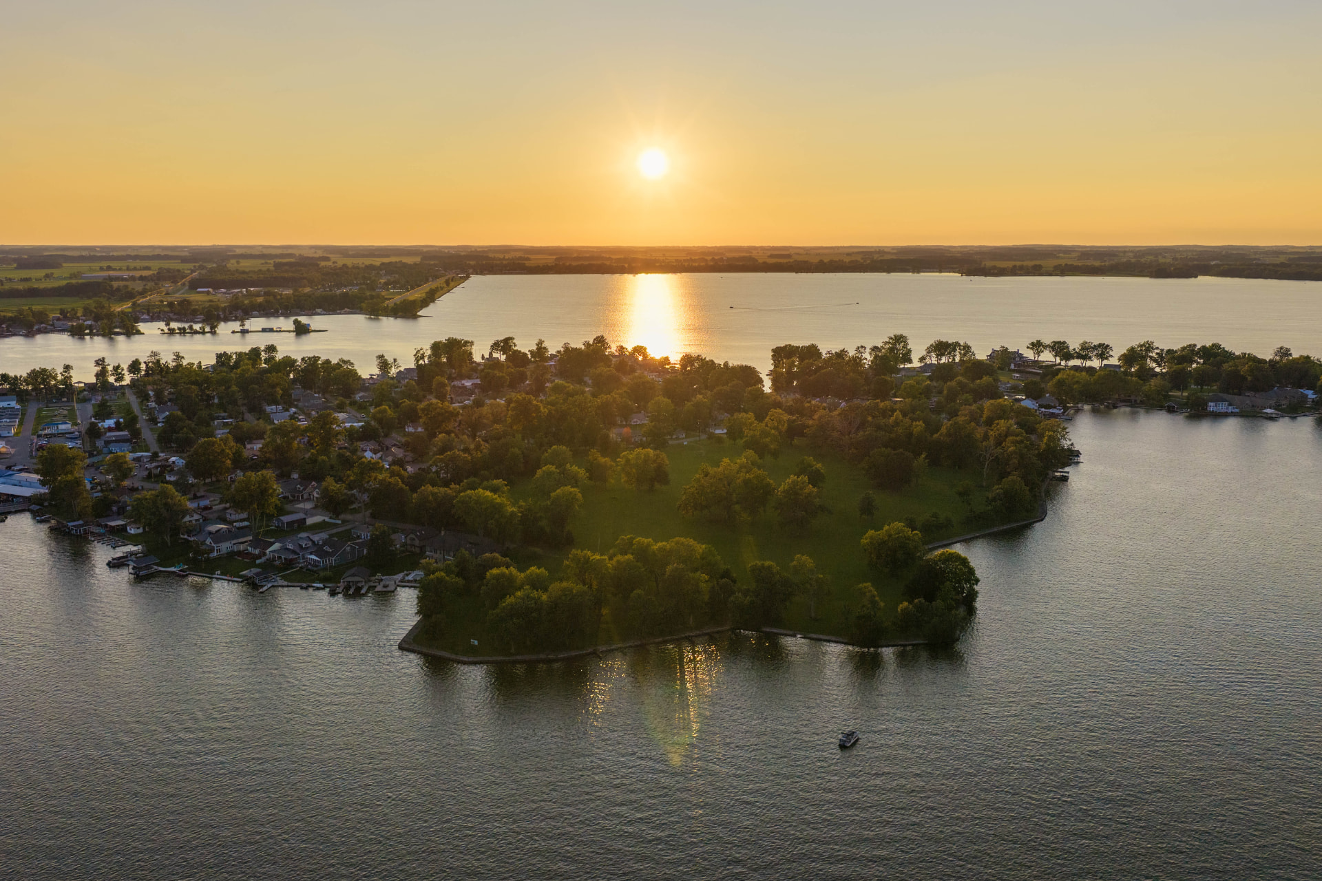 Sunset aerial across Indian Lake, its islands and the shoreline communities around them